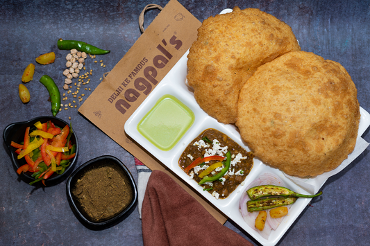 Delicious Chole Bhature - A quintessential North Indian dish known for its flavorful taste and crispy bhaturas served with spiced Channa masala